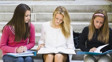 College girls sitting on campus steps.