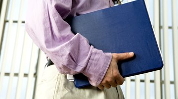 Close-up of student holding portfolio.