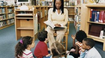 woman reading aloud to class