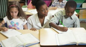 Teacher helping kids with schoolwork
