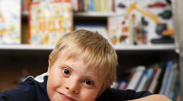 Children who can't talk may communicate by pointing to pictures in a communication book.