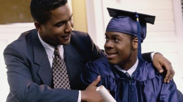 High school graduate smiling at father.