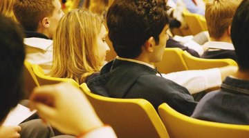 Students sitting in full lecture hall.
