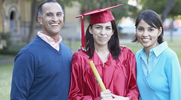 Smiling high school graduate holding diploma