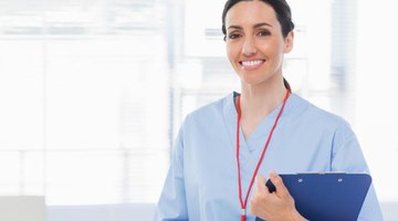 A nurse smiling in her office.