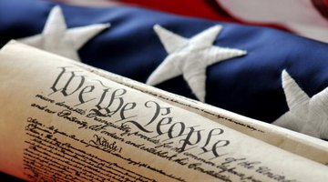The U.S. Constitution with an American flag.