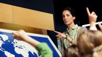 Teacher and students in geography classroom.