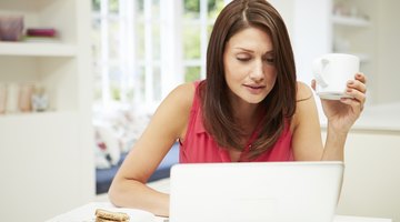 Woman working on her computer at home