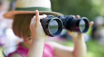 Girl looking through binoculars