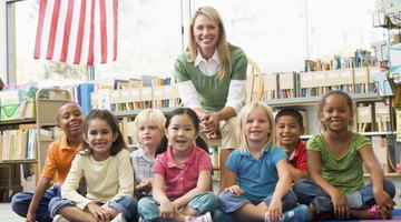 A kindergarten teacher with her class and an American flag.
