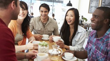 A group of friends hang out in a coffeehouse together to socialize.