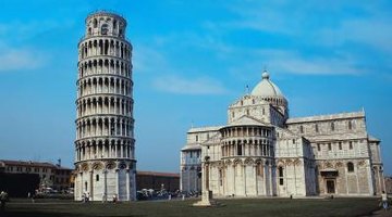 A statue commemorating Fibonacci stands beside the city's famous tower.