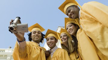Graduated students watching playback on video camera