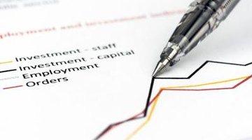 Pen on top of investment line graph paper