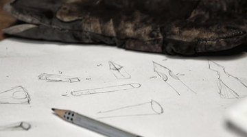 Tracing paper with shapes drawn on it.