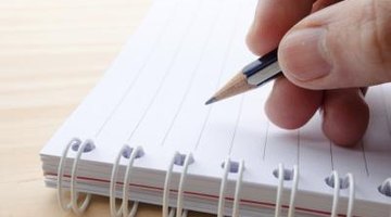 Pencil on top of notebook