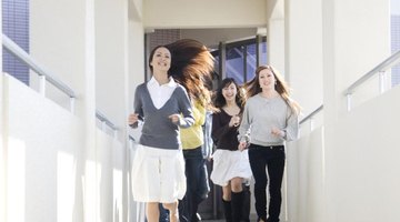 Students running down school hallway.