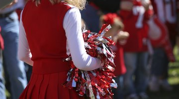 Cheerleader with pom poms