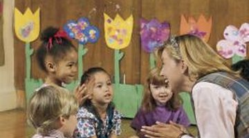 Kindergarten children enjoy listening to stories.