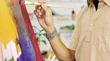 The fine art student spends many hours at his or her canvas working.