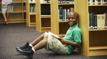 Student reading book in the library.