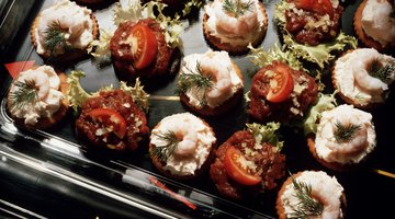 Close up of tatar and shrimp snacks as appetizers