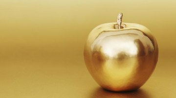 Golden apple in golden studio.