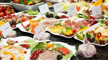 A full buffet with meat, cheese and fish