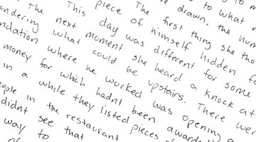A close-up of a hand-written story on paper.