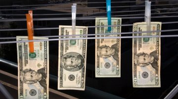 This image illustrates money laundering, which is figurative language.